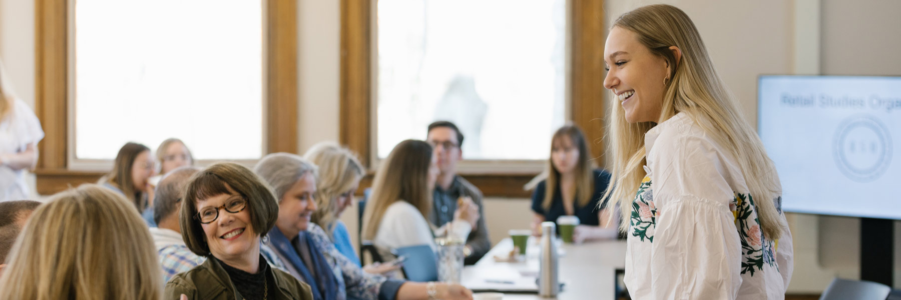 A student engages with her professors.