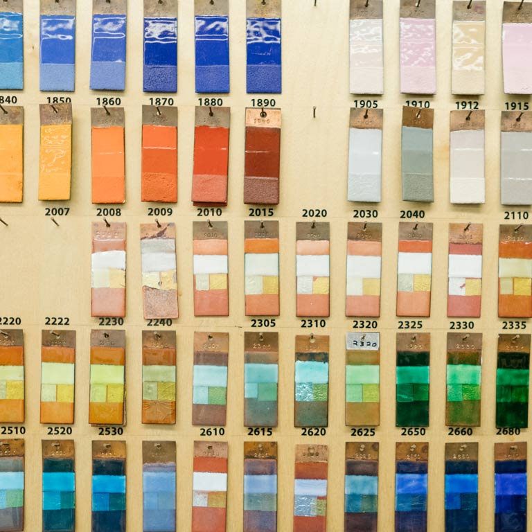 Color swatches hang on a wall.