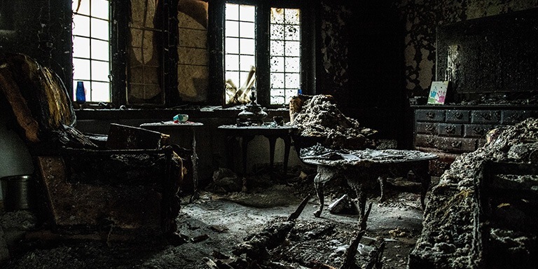 A room of blackened furniture.