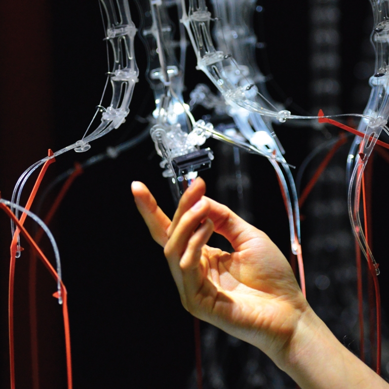 A close up of a hand manipulating wires.