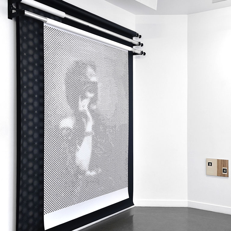 A large modern art piece on a wall.