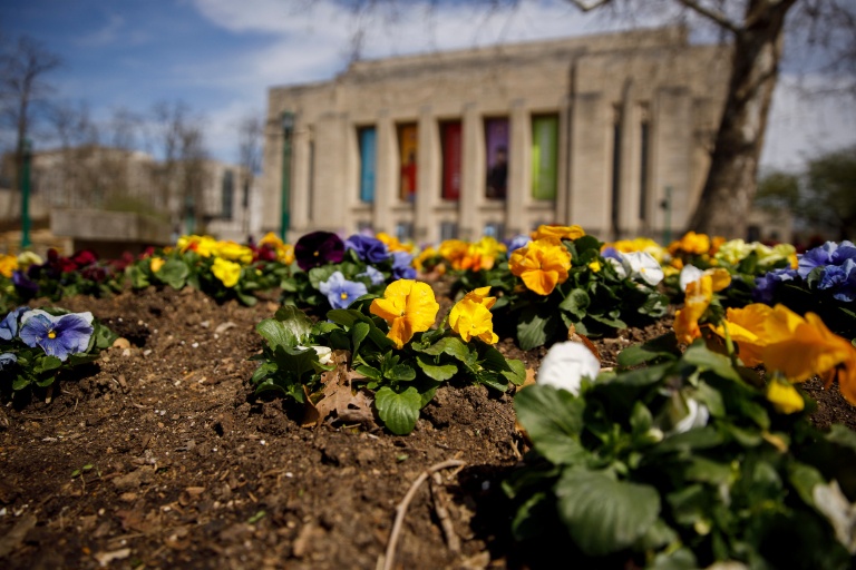 Students smile together on the runway.