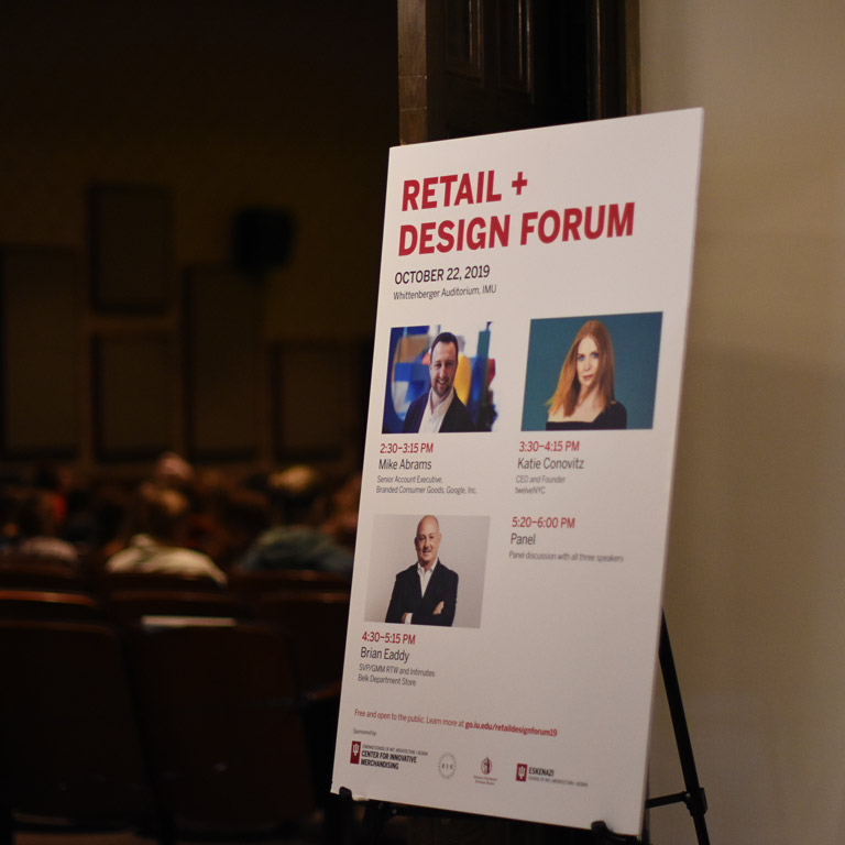 Four people participating in a panel discussion.