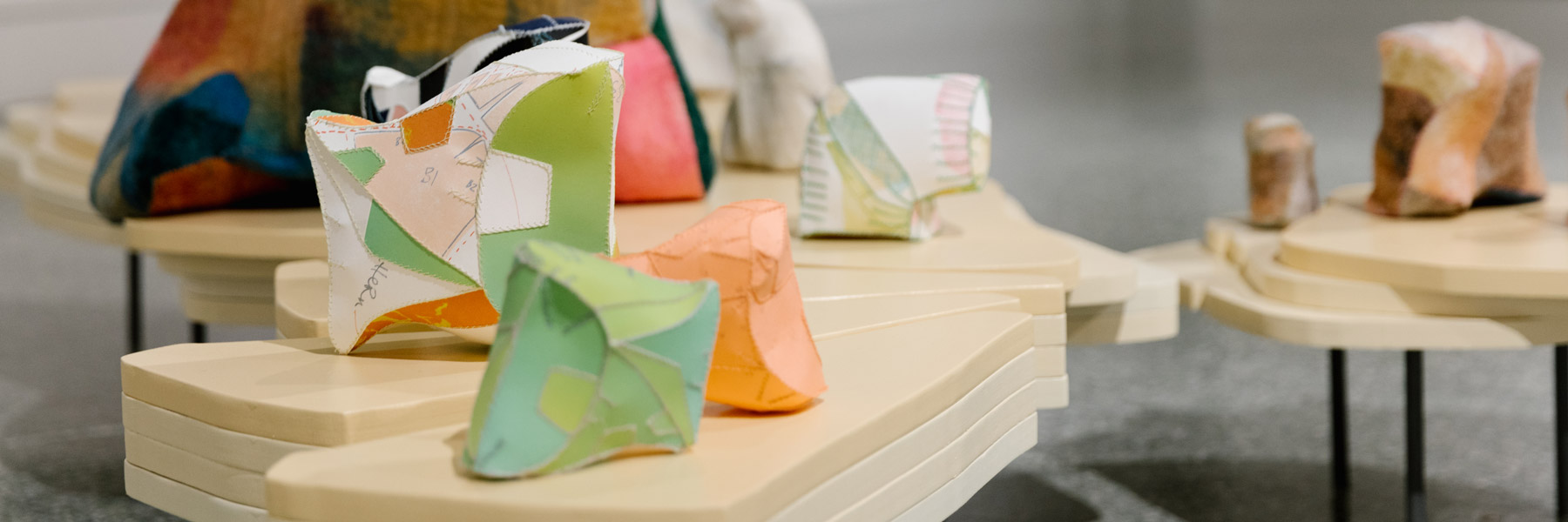 Small and colorful sewn sculptures.