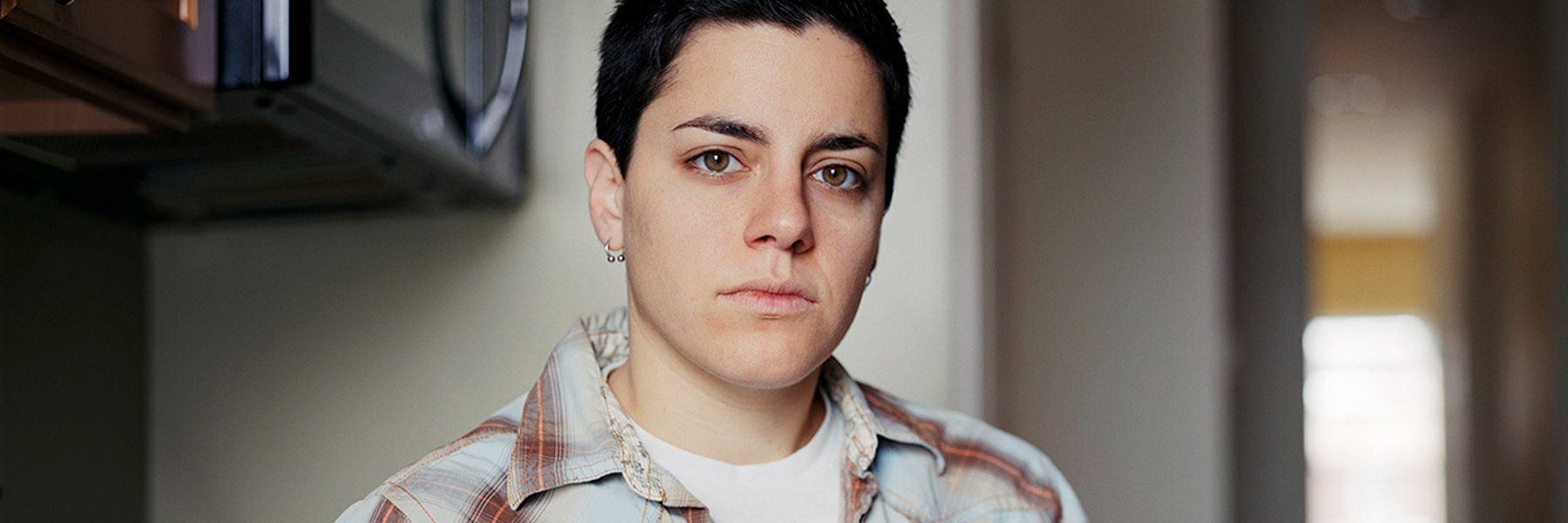 A person looks into a camera.