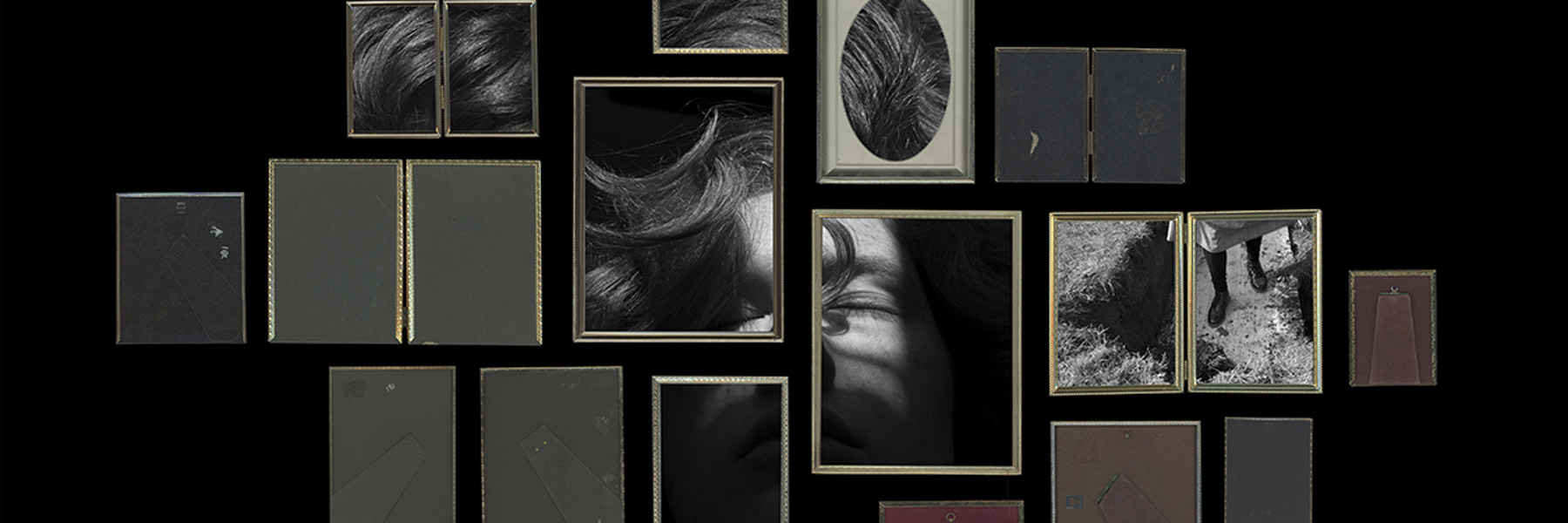 Small framed photos laid out on a black background.