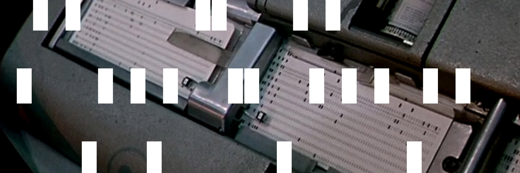 A muted-tone image with small rectangles placed purposefully on top in multiple places.