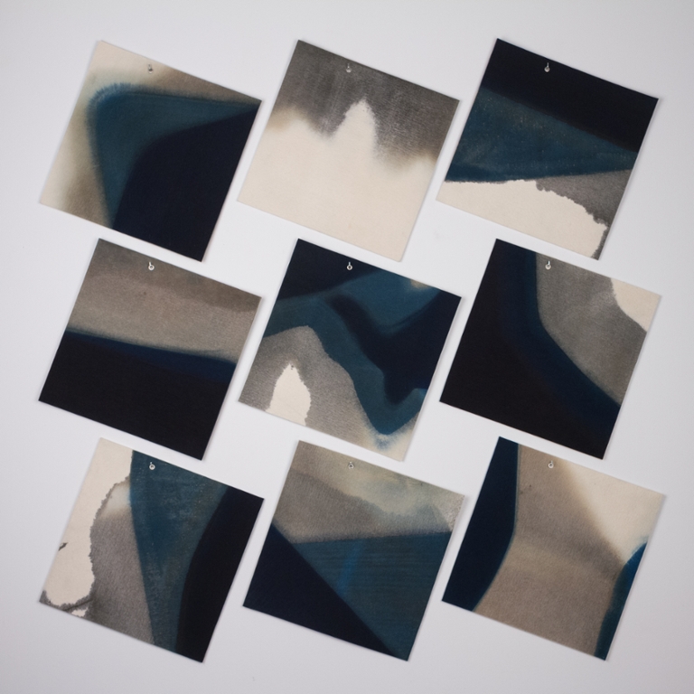 Square art hanging diagonally.