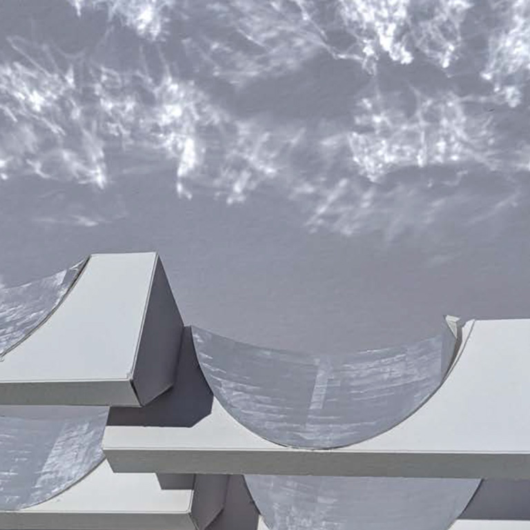 Silver and gray architectural shapes with water like reflections behind. 