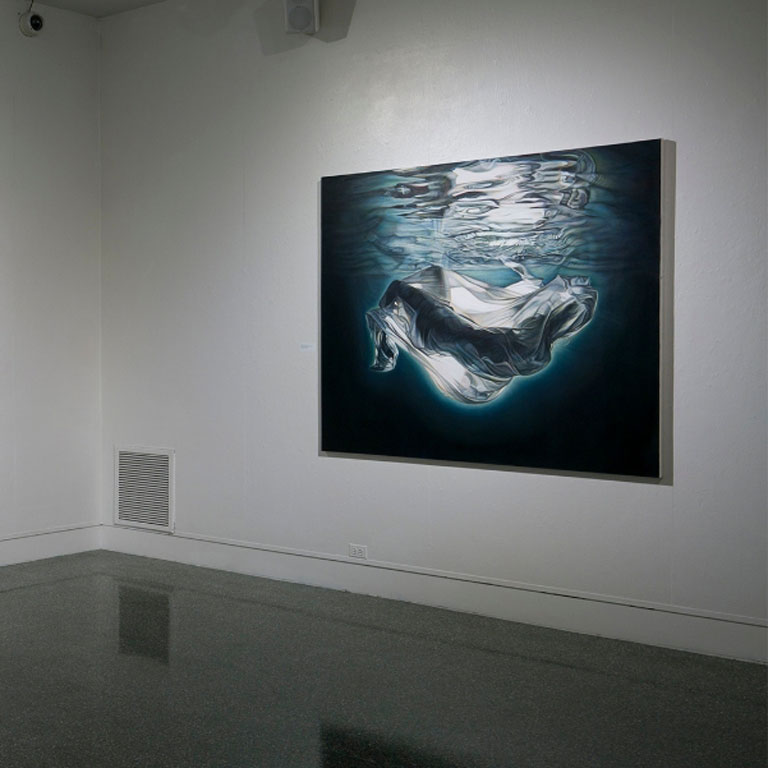 A painting hangs on a wall