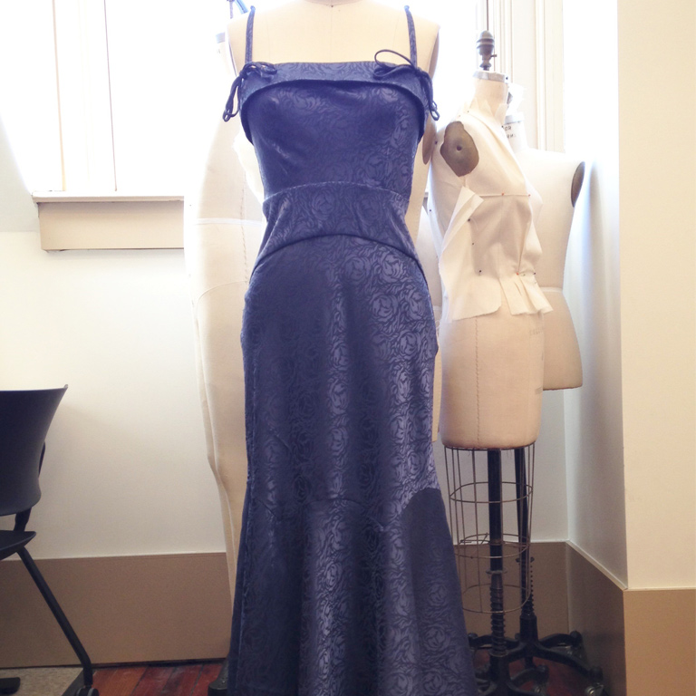 A blue dress on a mannequin.