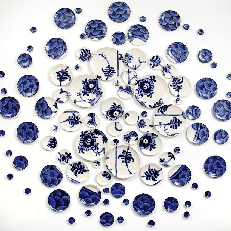 Blue and white plates on a wall